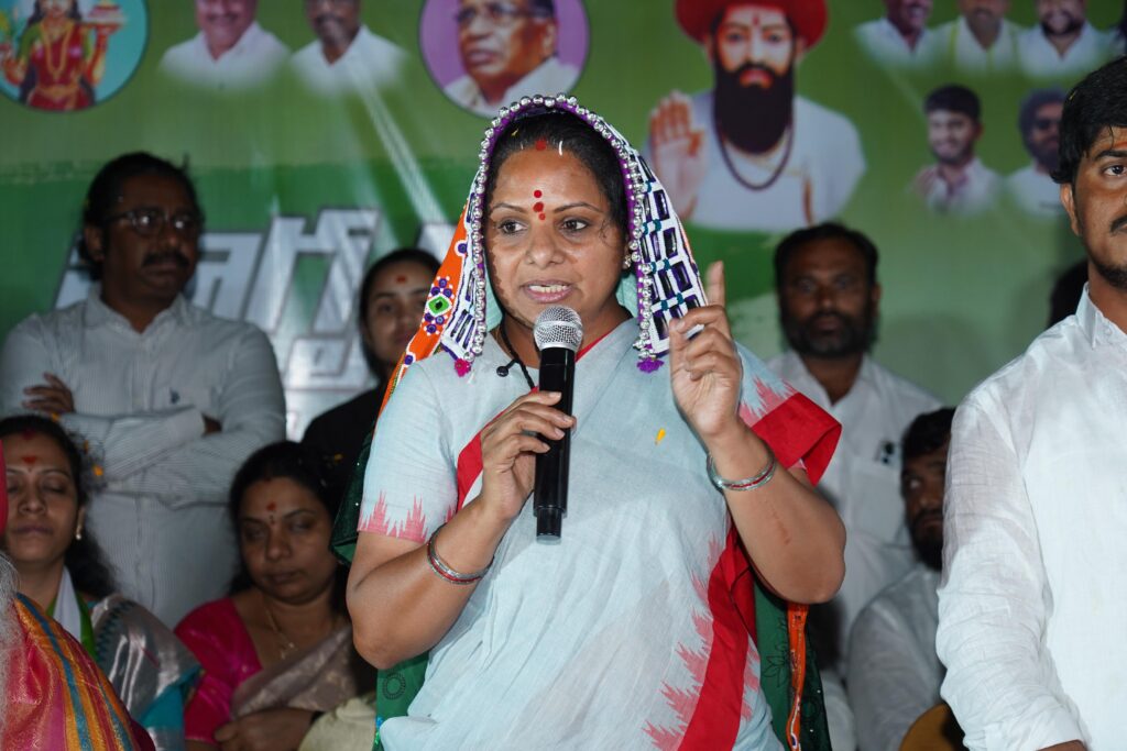 Telangana Jagruti leader Kavitha with tribal families at Tanda